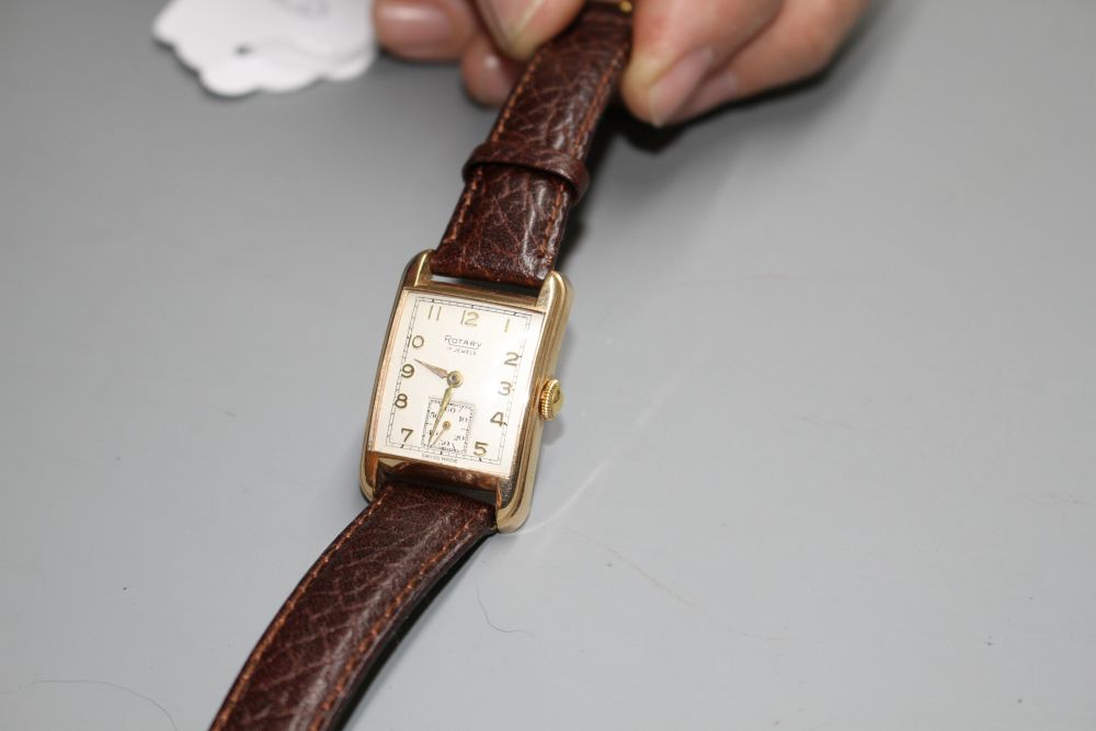 A gentlemans early 1950s 9ct gold Rotary manual wind wrist watch, the rectangular dial with Arabic numerals and subsidiary seconds,